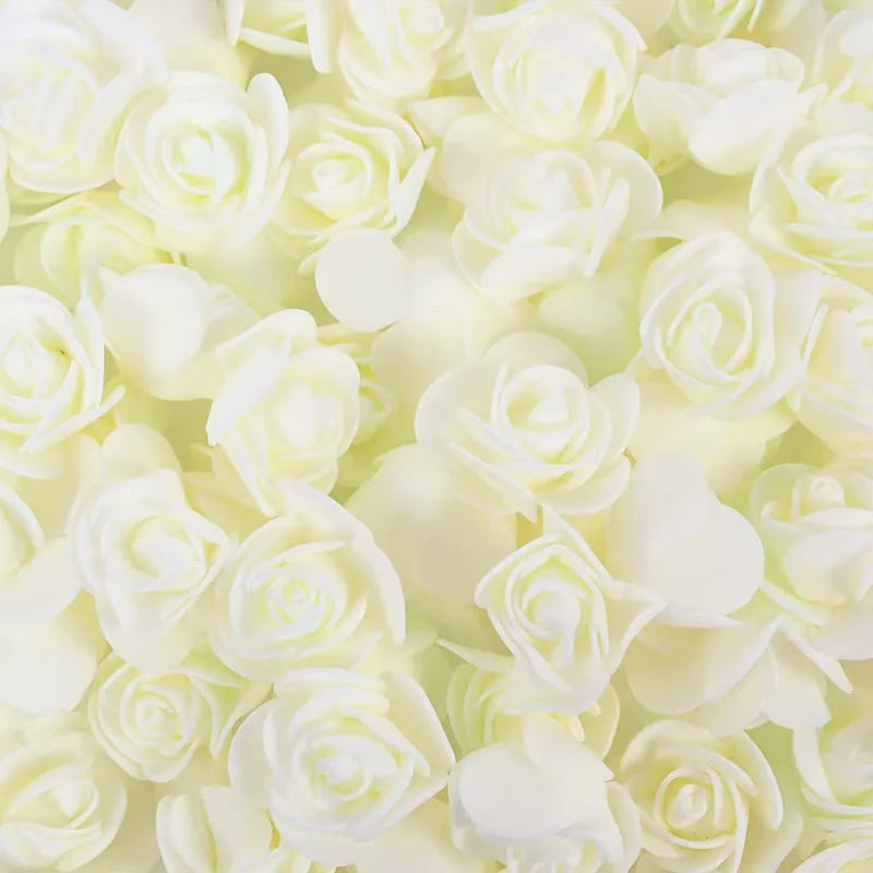 A close-up of a bulk pack of realistic white foam rose flowers for weddings and events.
