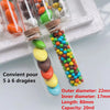 Mini glass bottles with cork stoppers filled with colorful candies for DIY crafts
