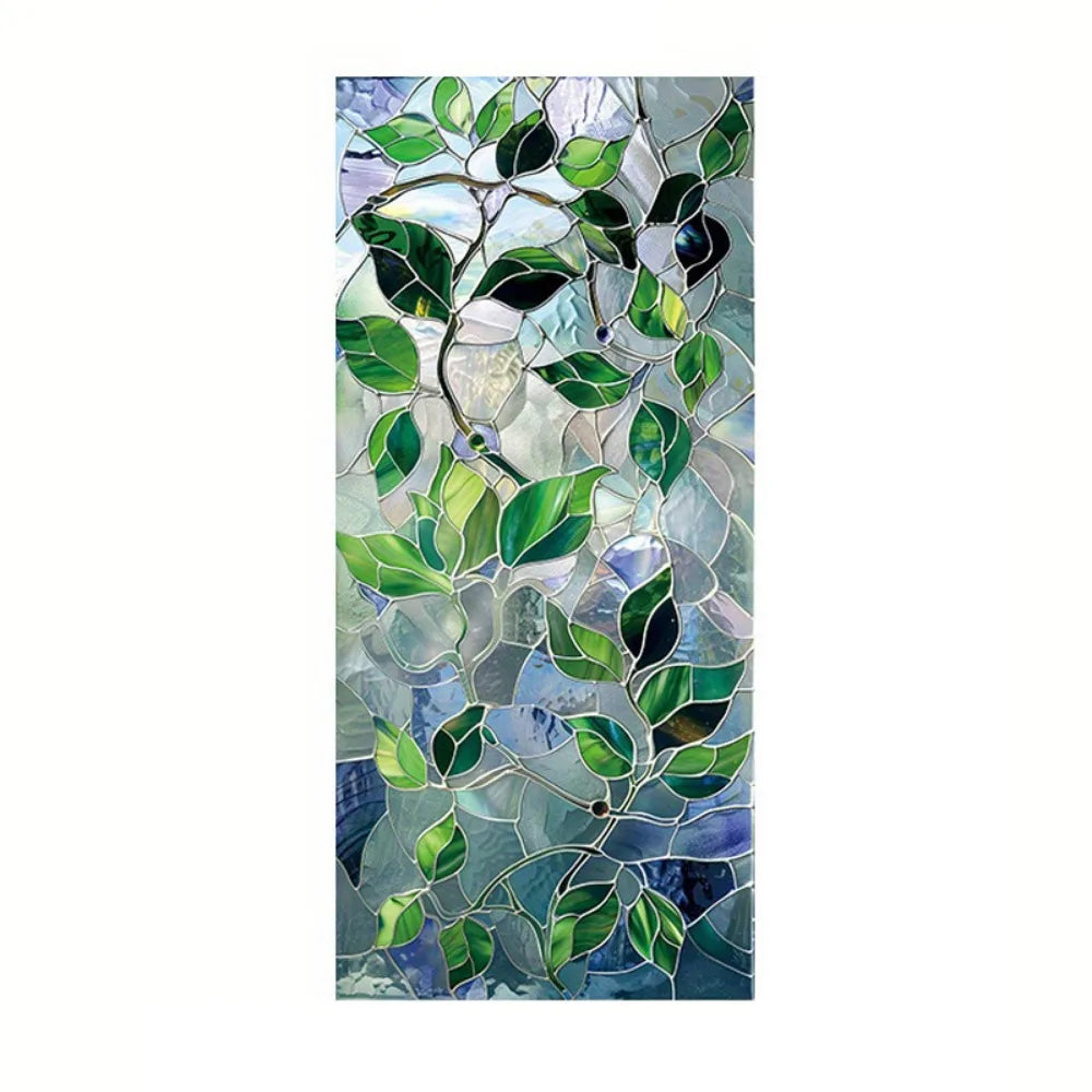 Abstract glass art featuring green leaves and blue tones in a mosaic pattern.