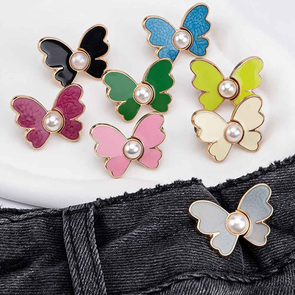 A set of colorful pearl butterfly buttons used as waist tightener closures for jeans.