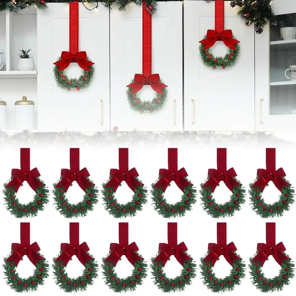 A set of ten artificial Christmas wreaths with red berries and velvet bows hanging on white doors.