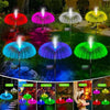 A collection of solar jellyfish garden lights in various colors including red, pink, white, blue, purple, and green illuminat