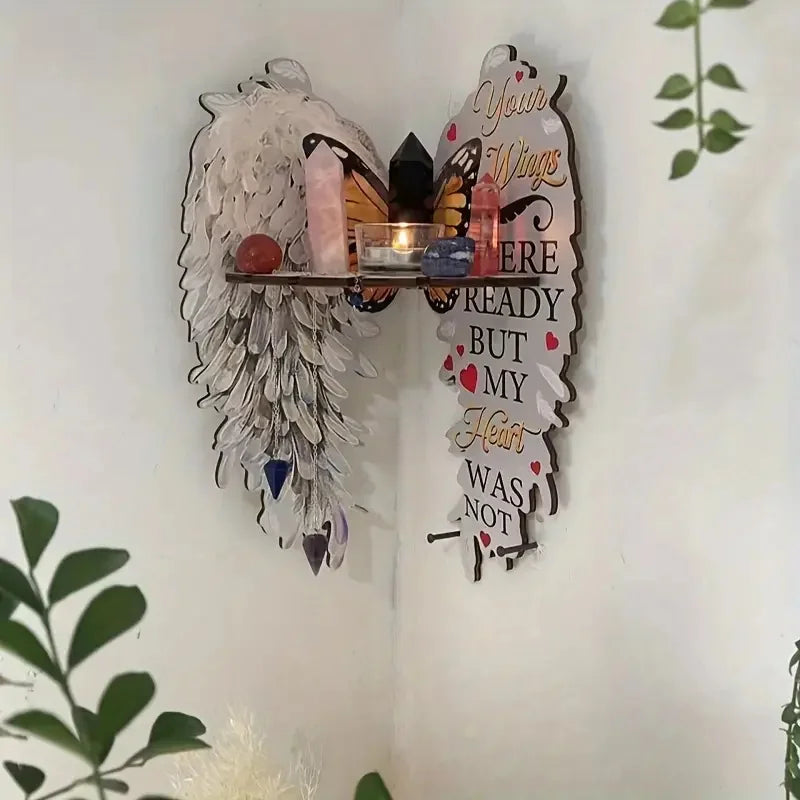 A boho wood angel wing wall shelf displaying crystals and a message about a heart.
