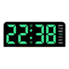 A digital alarm clock displaying 22:38 with a green LED display and day of the week information.