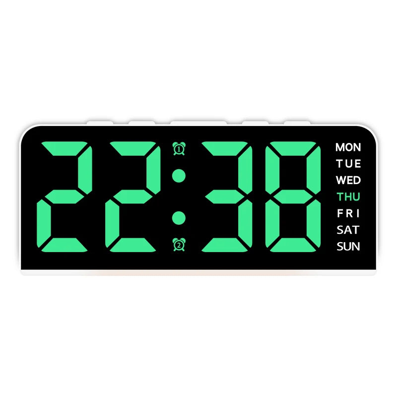 A digital alarm clock displaying 22:38 with a green LED display and day of the week information.