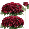A bouquet of deep red artificial silk roses in a lush arrangement.