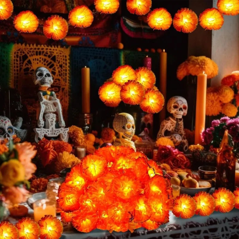 A close-up of bright orange LED marigold string lights illuminating festive decor.