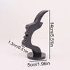 A black minimalist side face glasses holder with a curved design, shown in profile and with dimensions.