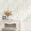 Boho floral peel and stick wallpaper featuring a dense mix of colorful wildflowers on a white background.