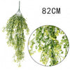 A long, cascading artificial plant vine wall hanging with small green leaves.
