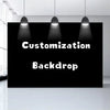 A black backdrop with the words Customization and Backdrop displayed under three hanging lights.