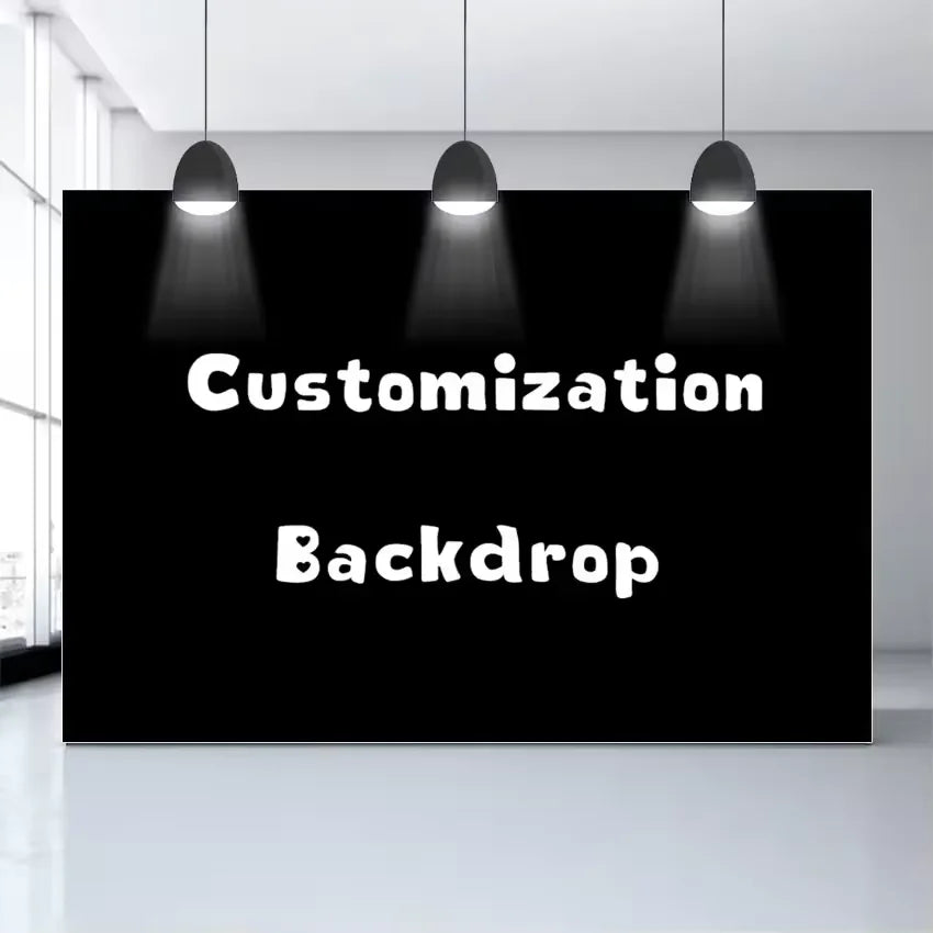 A black backdrop with the words Customization and Backdrop displayed under three hanging lights.