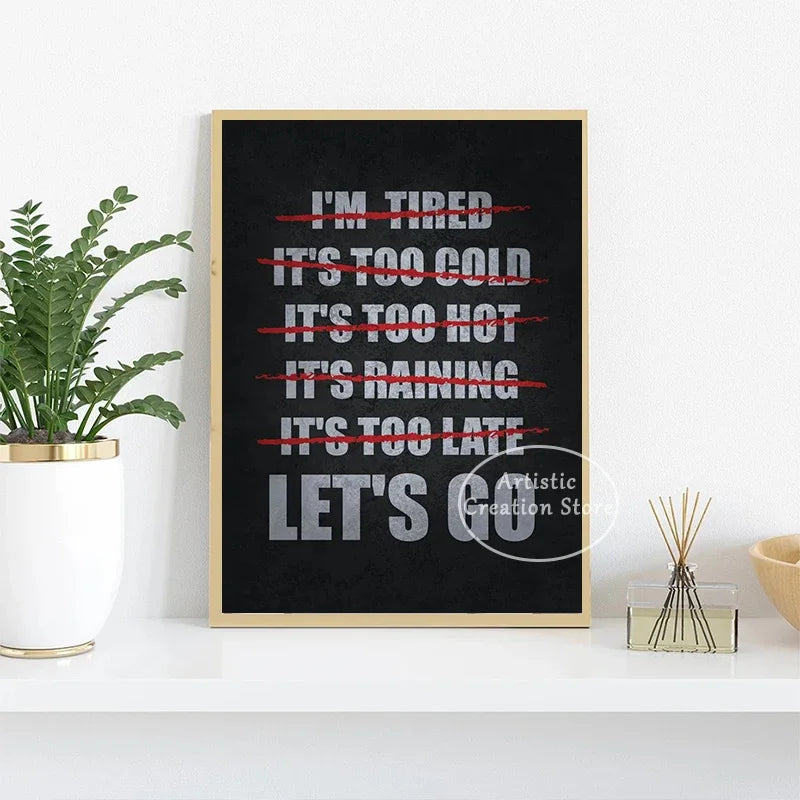 A black canvas print with white text listing various complaints like I'm tired it's too cold it's too hot it's raining and it