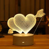 A white acrylic heart shape light is displayed on a dark base, illuminated by an LED.