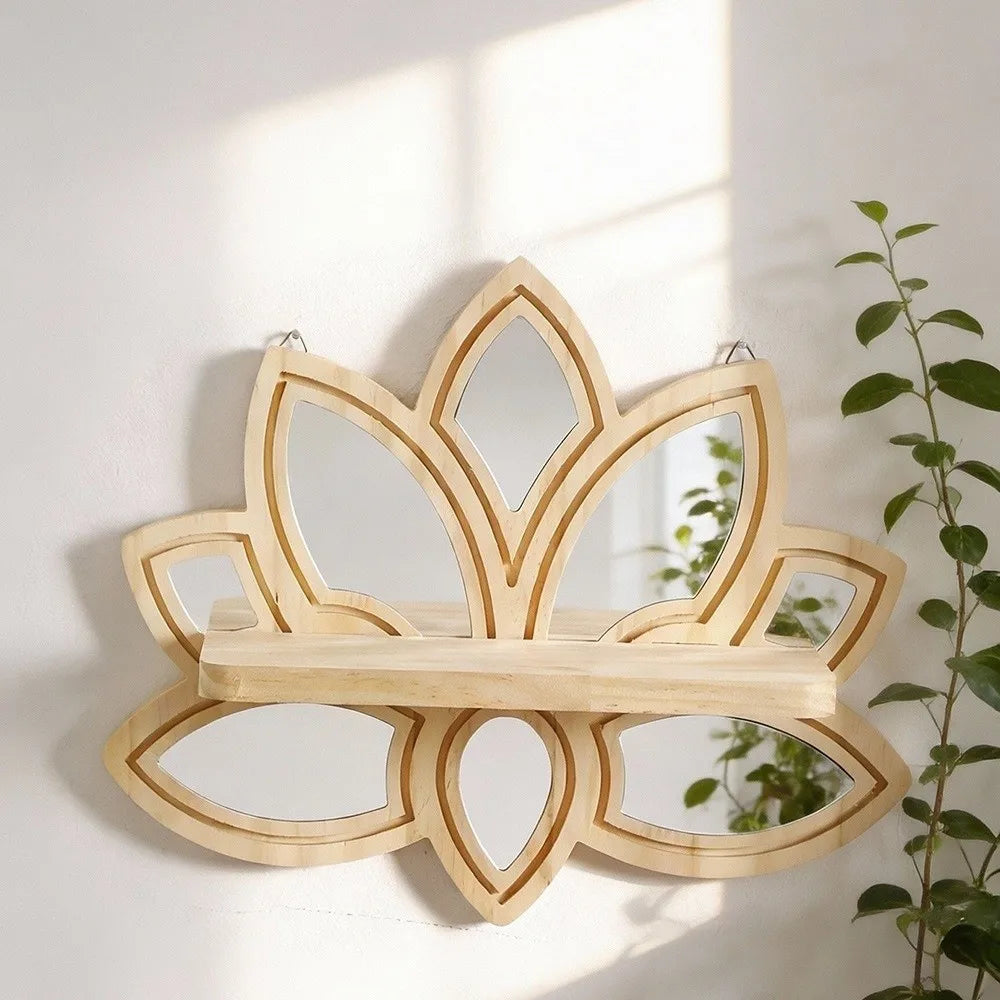 A decorative wooden lotus floating shelf with a mirrored design mounted on a white wall.