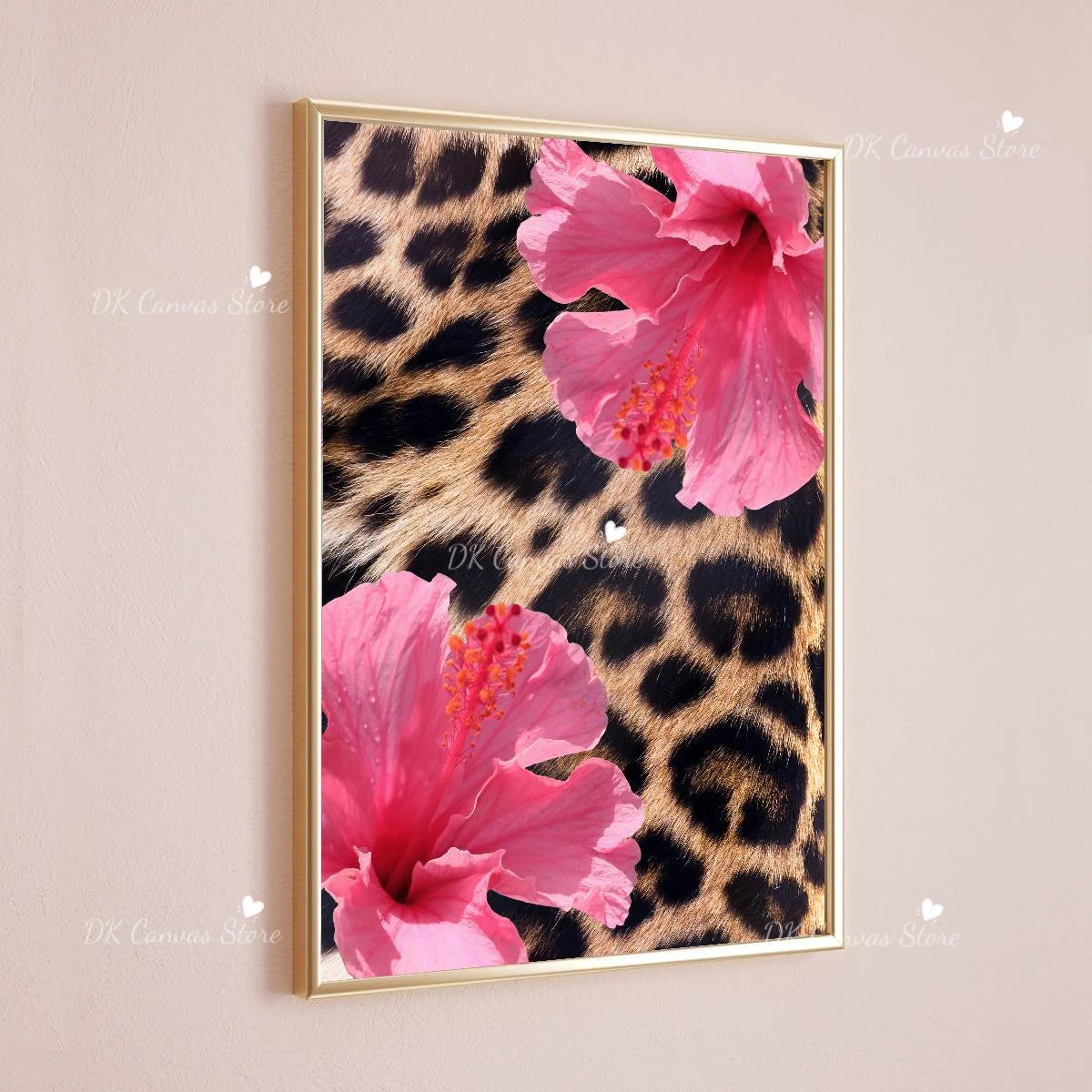 Pink leopard hibiscus flower canvas wall art in a gold frame