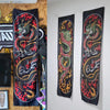 Black flame serpent vertical tapestry wall hanging featuring vibrant red and orange accents