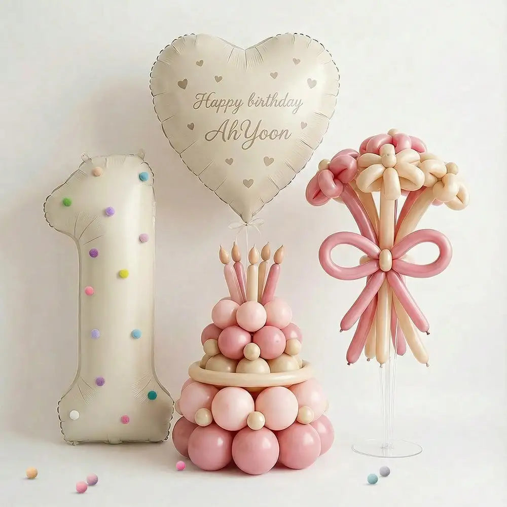 A display featuring a large number balloon, a heart-shaped birthday balloon, and a cluster of pink and cream spherical balloo
