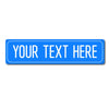 A rectangular blue street sign with the text YOUR TEXT HERE in white capital letters.