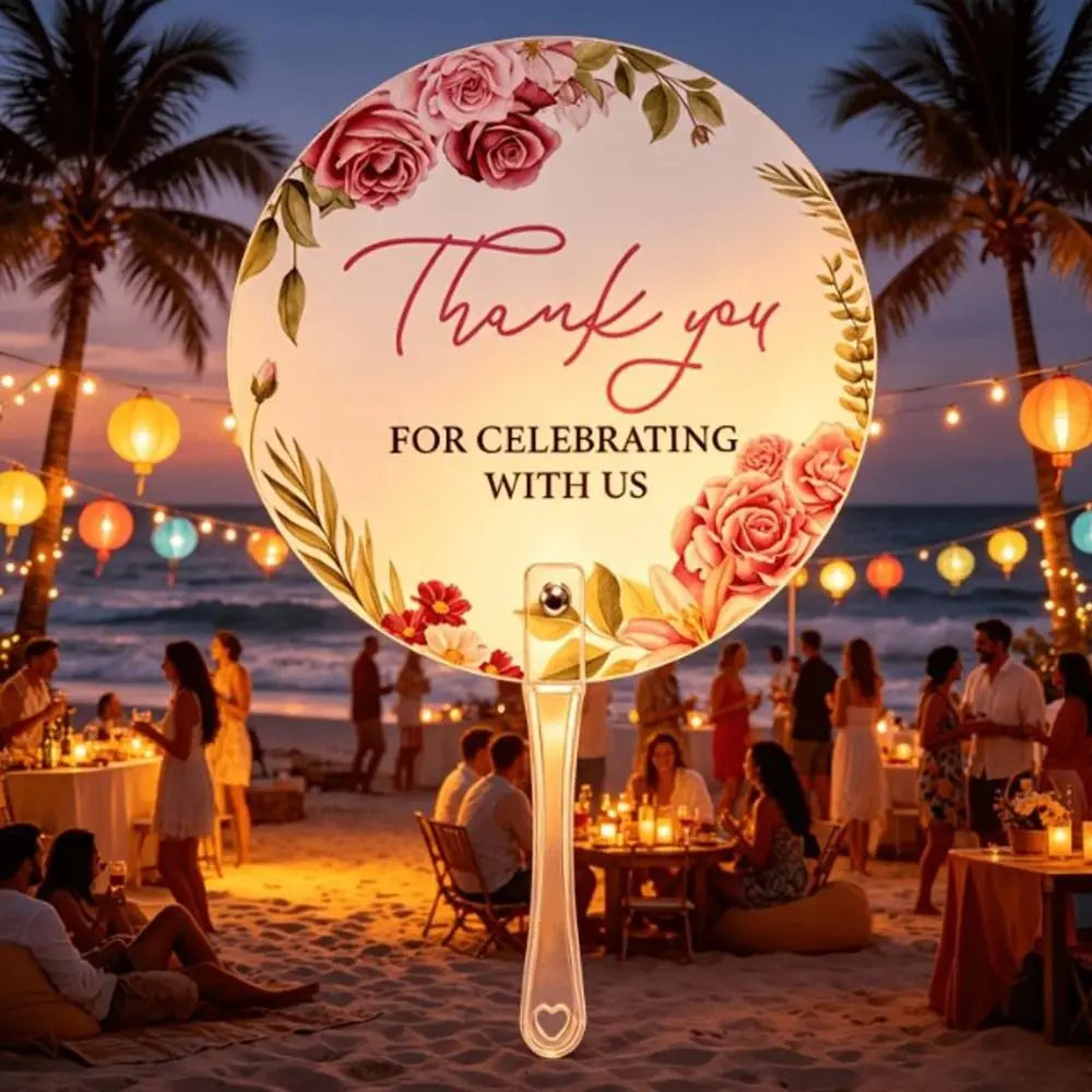 A large circular sign with pink floral designs and the text Thank you for celebrating with us is displayed on a glass hand fa