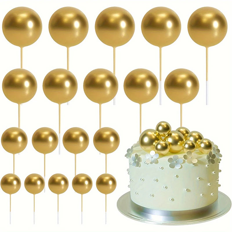 A set of twenty gold spherical cake toppers on sticks.