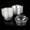 A stack of clear plastic cupcake boxes with lids, showing various sizes and a reflective surface.