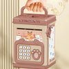 A portable handheld electronic ATM piggy bank with a pink casing and keypad is being held by a hand.