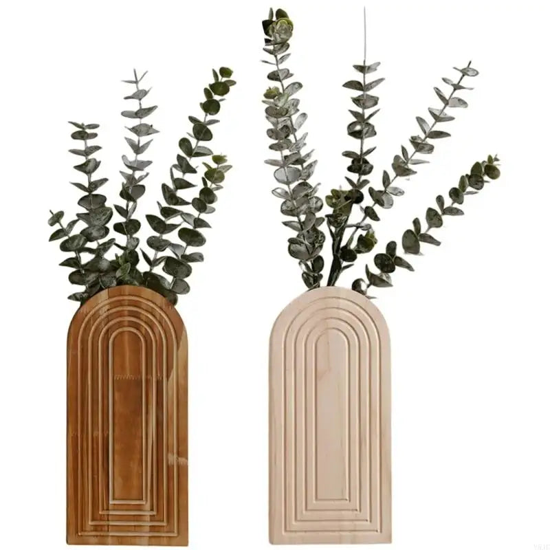 Modern farmhouse wall planter featuring eucalyptus greenery in a light wood frame.