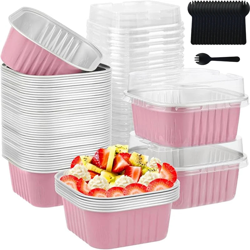 A set of reusable pink and white aluminum foil baking cups with lids and spoons.