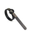 A black adjustable ring sizer with a built-in magnifier and a flat band.