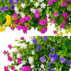 A vibrant arrangement of faux floral plants featuring purple, white, and pink blossoms on green foliage.