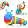 A colorful, flexible fidget slug toy is shown being held by a hand and lying on a surface.