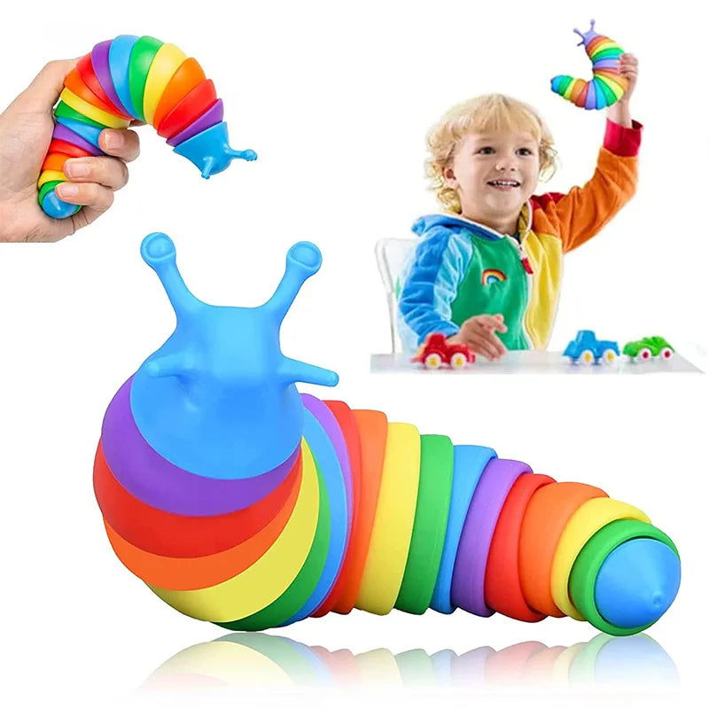 A colorful, flexible fidget slug toy is shown being held by a hand and lying on a surface.