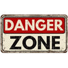 A vintage, distressed rectangular sign with a red background and white text that reads DANGER ZONE.