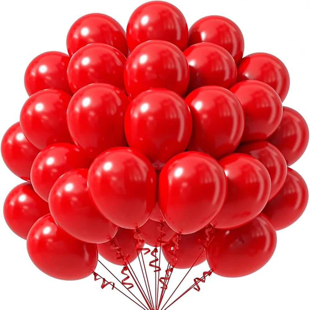 A cluster of bright red latex balloons used for party decorations.