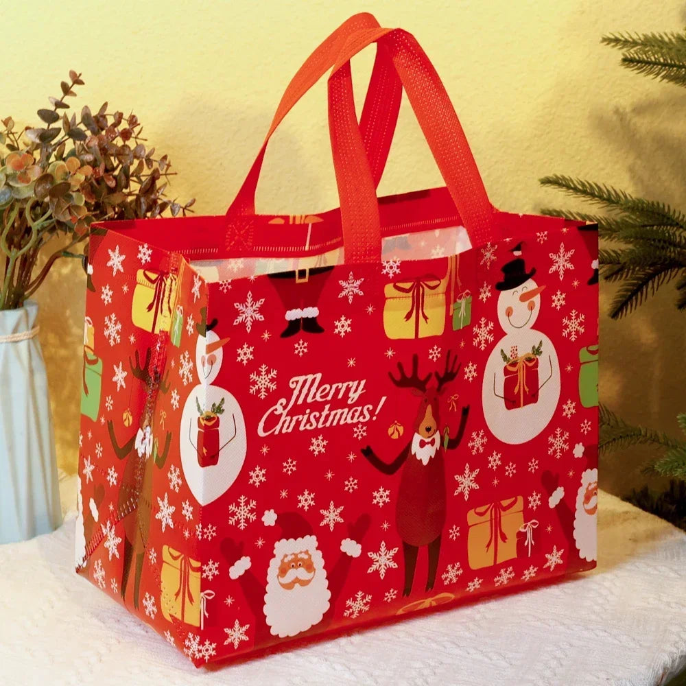 A red festive Christmas tote bag with white snowflake and holiday designs, featuring orange handles.