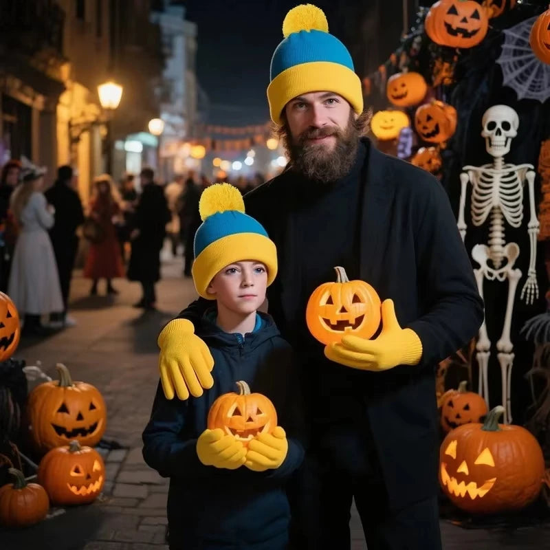 A man wearing a black coat holding an orange pumpkin and a child wearing a blue knitted beanie and yellow gloves.