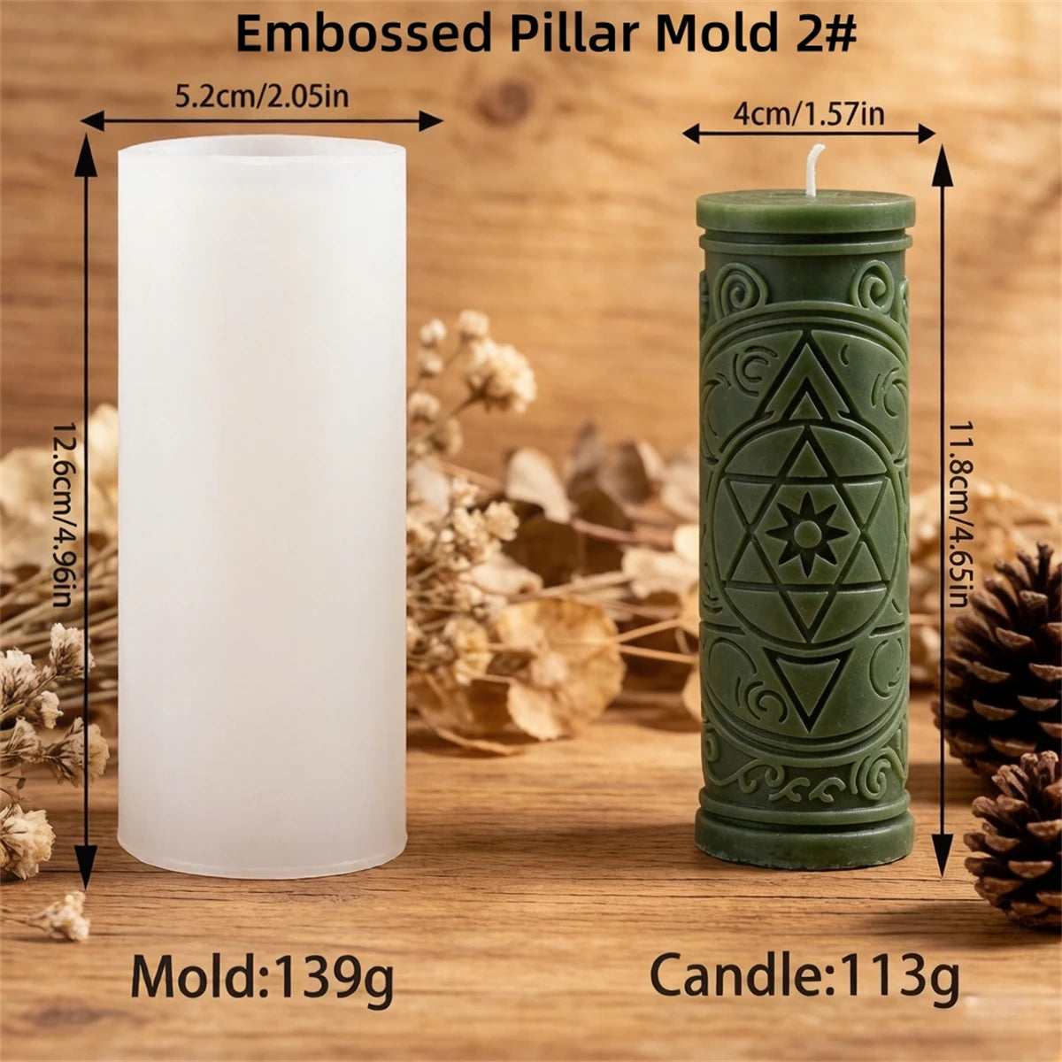 A white pillar candle mold and a green embossed pillar candle are shown on a wooden surface.
