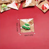 Assorted Christmas resin fridge magnets featuring Santa, snowman, and tree designs on kraft paper