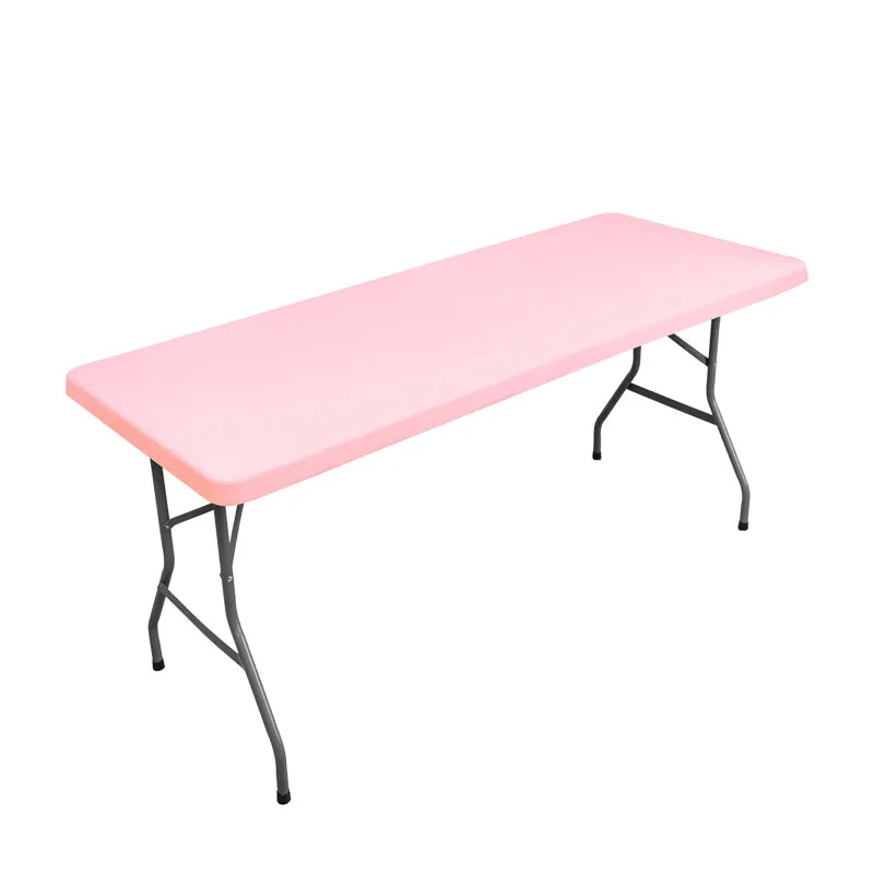 A pink stretch tablecloth dining table with black metal legs.