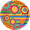 A colorful plate featuring a vibrant, geometric pattern in shades of red, orange, yellow, green, and blue.
