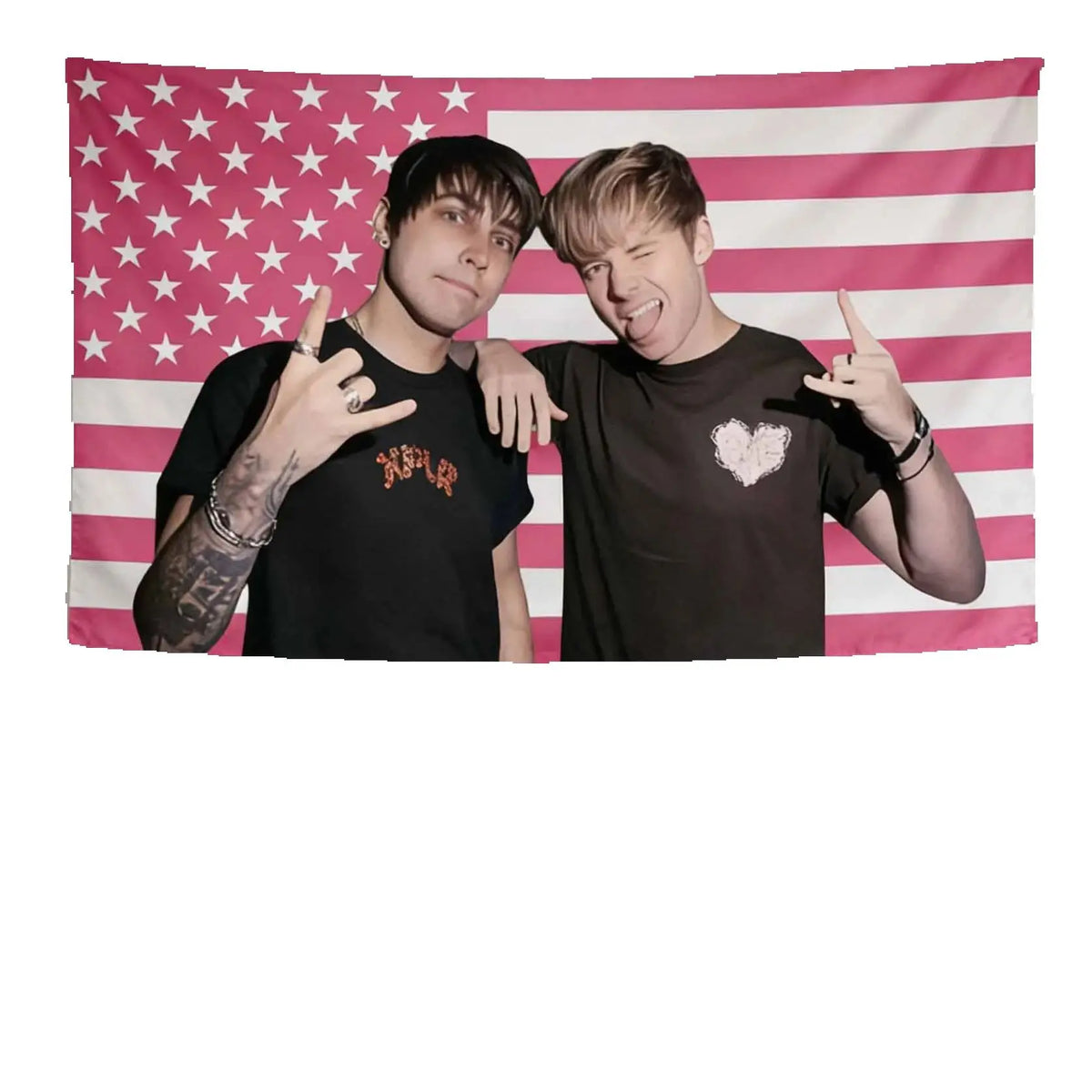 Two young men pose in front of an American flag tapestry with stars and stripes.