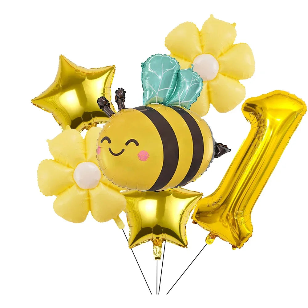A set of six yellow and gold aluminum foil daisy balloons with a bee design and green accents.