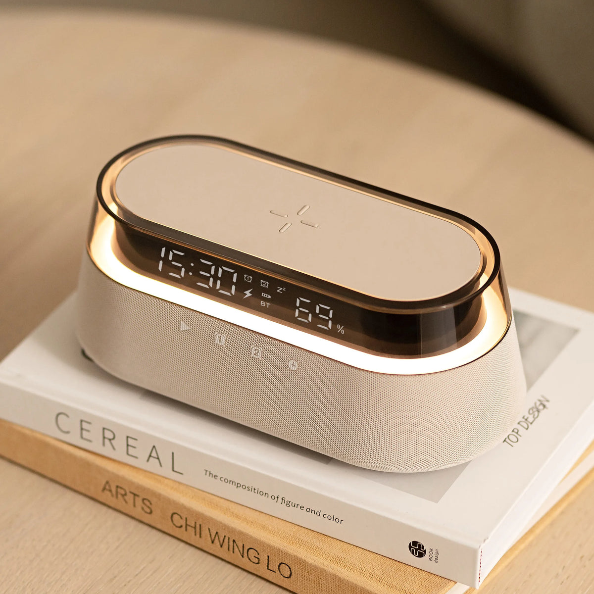 A beige wireless charging speaker lamp with a wooden base and illuminated display showing 15:30 and 69% battery life.