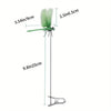 A green dragonfly hat clip with a long wire and a metal hook for garden decor.
