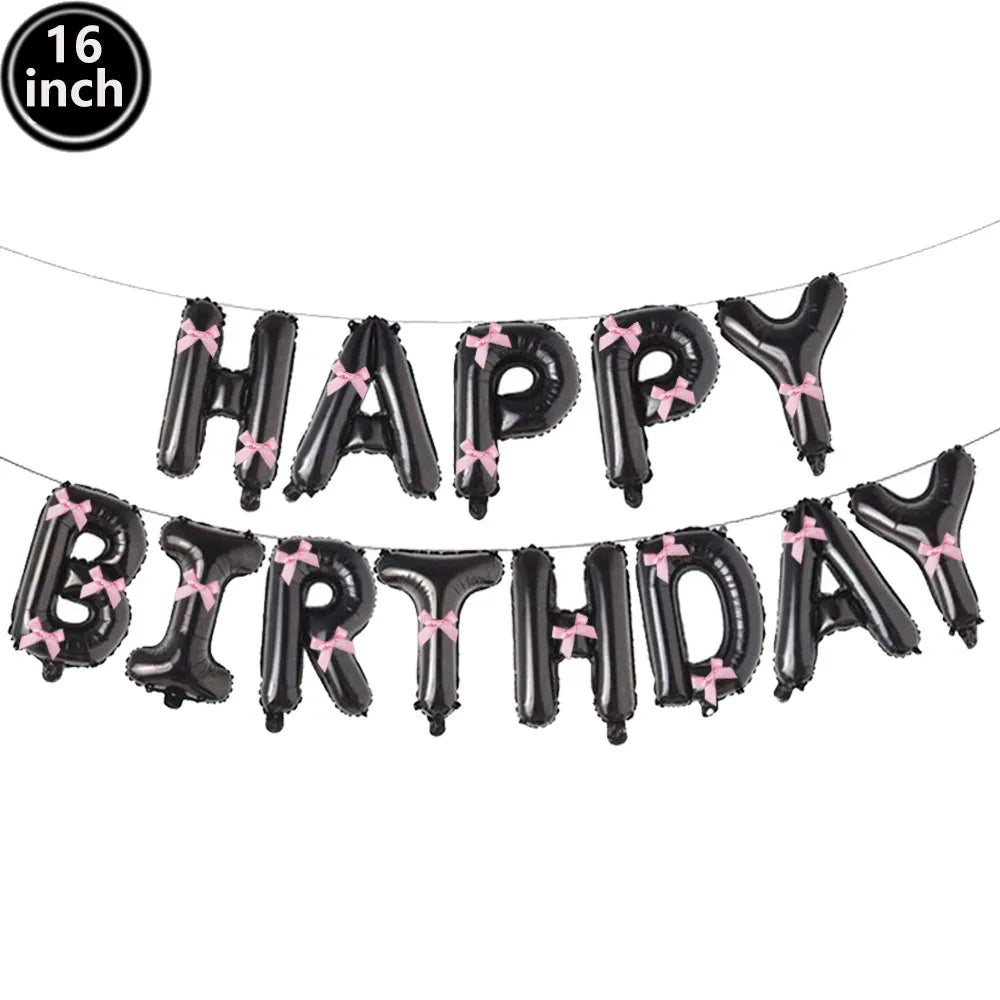 A string of black foil letter balloons spelling out HAPPY BIRTHDAY for a party decoration set.