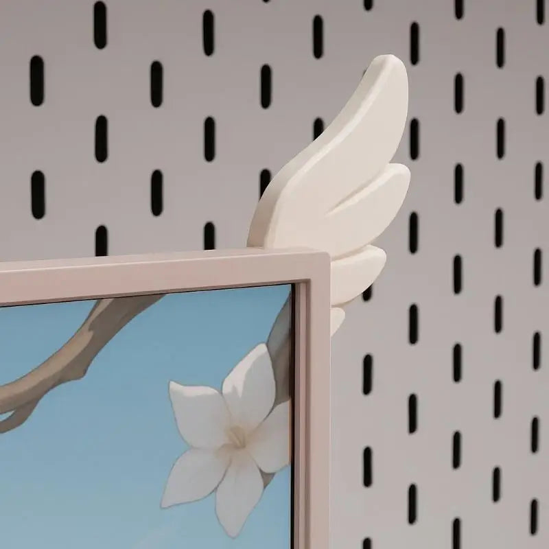 A pair of white, wing-shaped decorations are displayed against a patterned wall background.