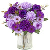 A vibrant bouquet of artificial mixed flowers featuring purple, lavender, and deep violet roses, daisies, and chrysanthemums 