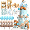 A tiered baby shower cake decorated with teddy bears, stars, clouds, and blue accents.