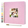 Pink linen cover scrapbook album with a photo of a couple embracing outdoors